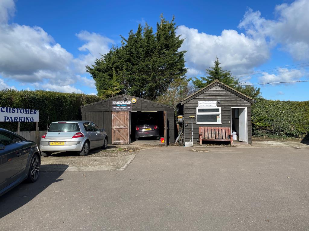 Lot: 73 - FORMER SERVICE STATION/CAR SALES SITE WITH BUNGALOW & WORKSHOPS, OFFERING POTENTIAL - Timber framed workshop and office